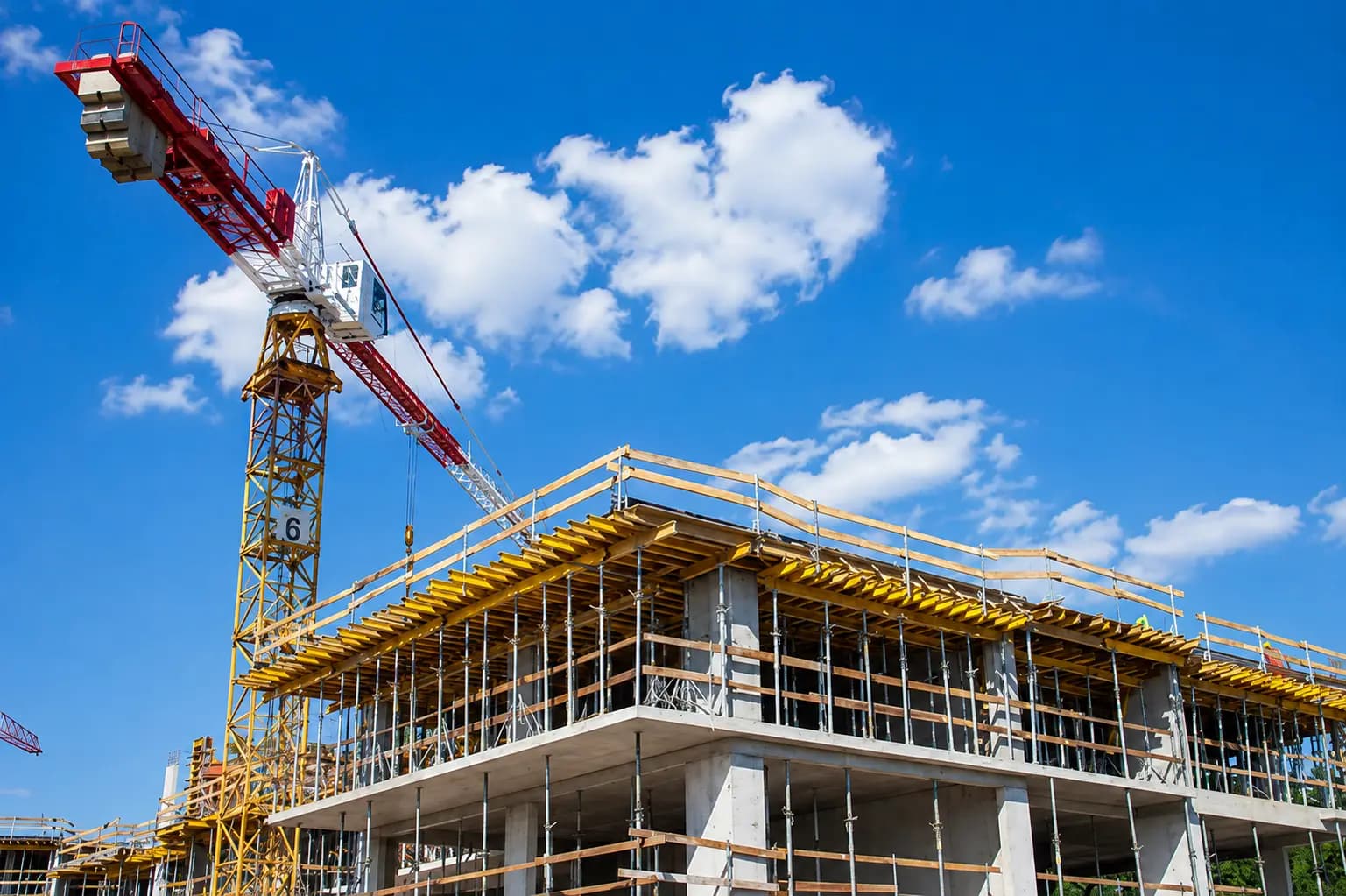 Sri Constructions site engineering and active structural progress banner.